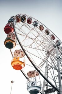 Colorful ferris wheel against a clear sky, creating a sense of adventure and joy.